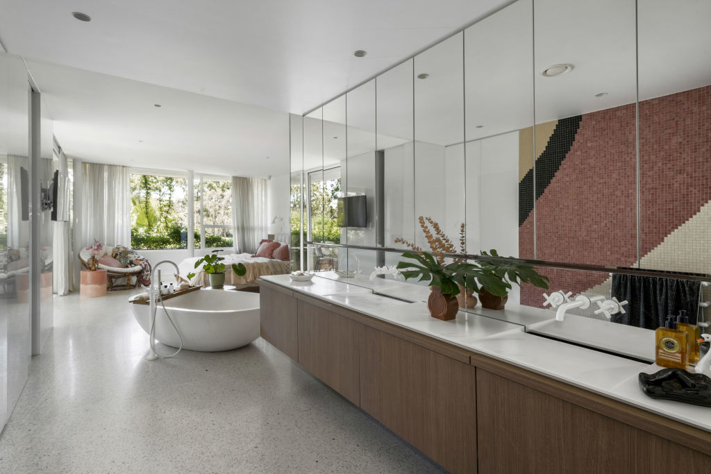 Mosaic tiles in the bathroom offer a retro feel. Photo: Supplied