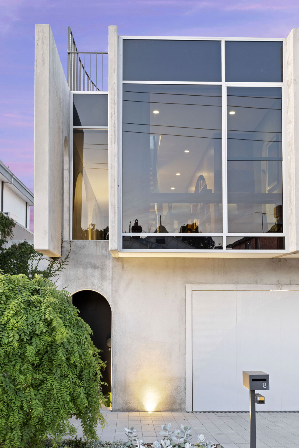 The arched entrance draws you into the property. Photo: Supplied