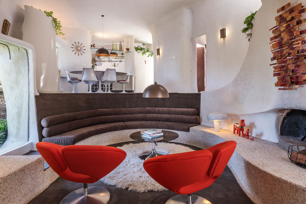 The sunken lounge, or 'conversation pit’, is the heart of the house. Photo: Des Harris/CREATIVE Property Marketing