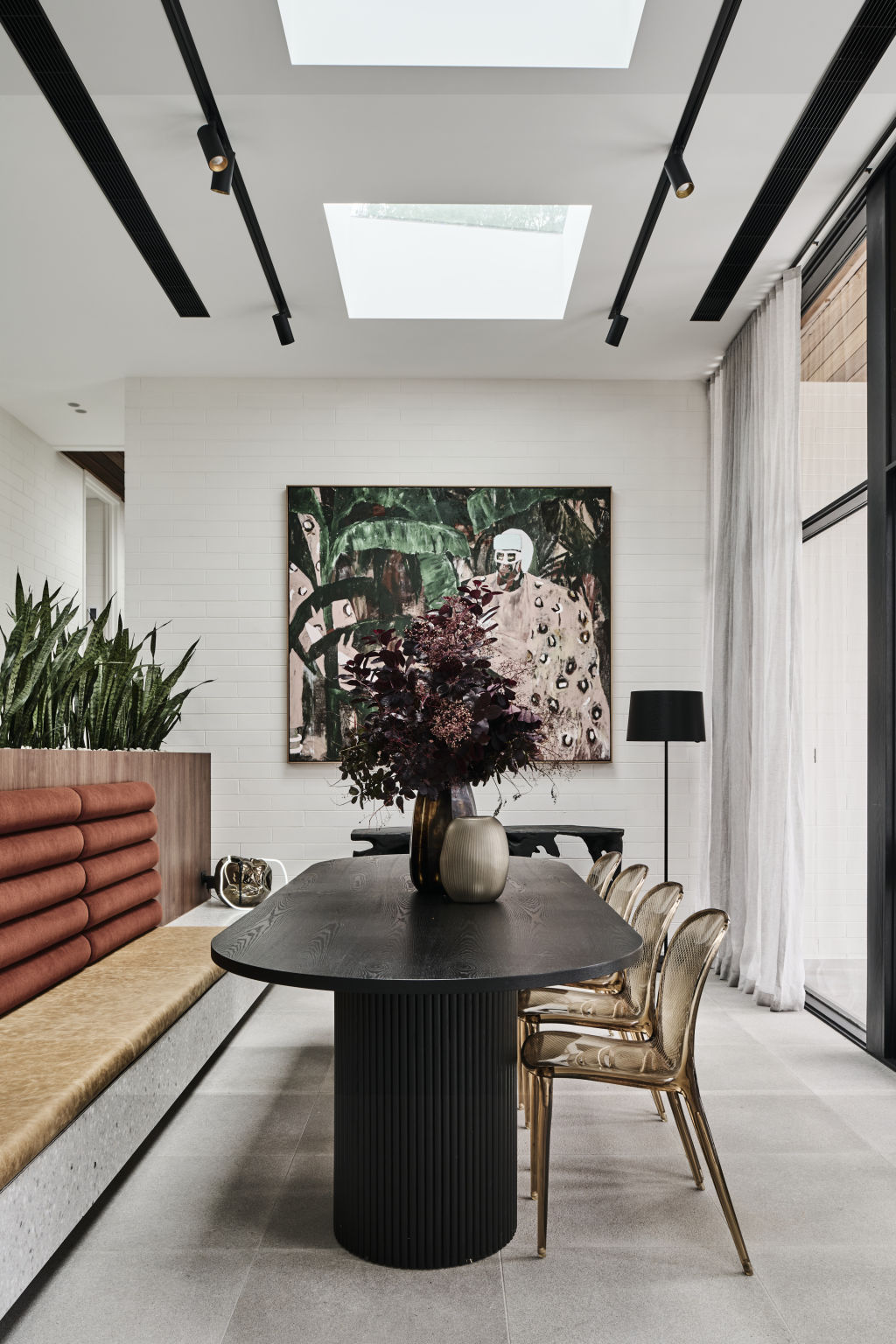 The dining room is fitted with a terrazzo bench featuring a leather cushioned seat and an alpaca velvet backrest. Photo: Supplied