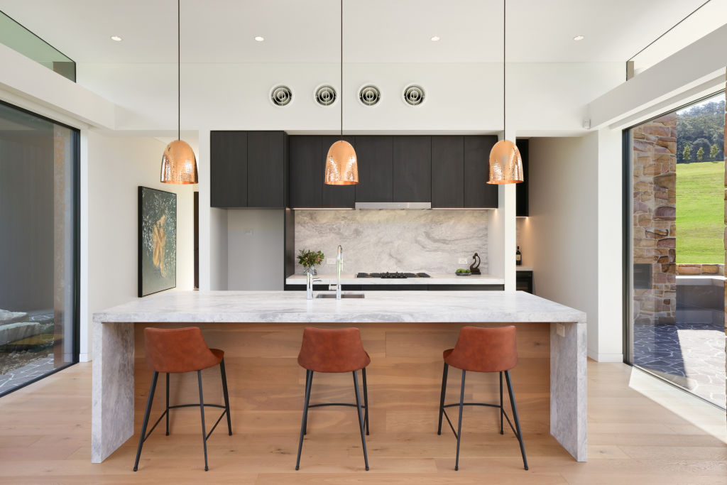 The kitchen features Italian Aquila marble benchtops and Gaggenau appliances. Photo: Supplied