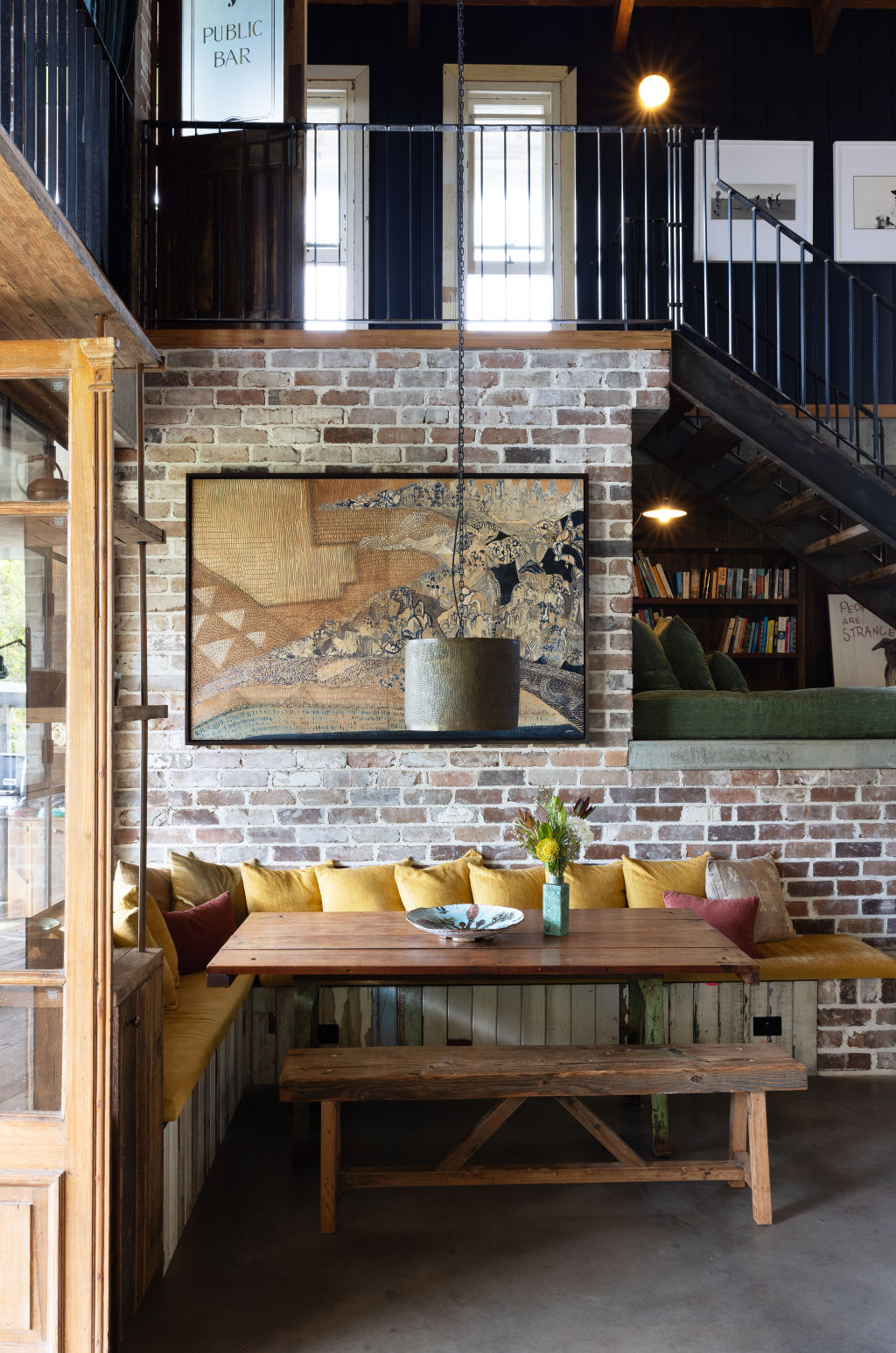 The home was built using timber from old bridges and flooring made from 100-year-old telegraph poles. Photo: Louise Roche - The Design Villa