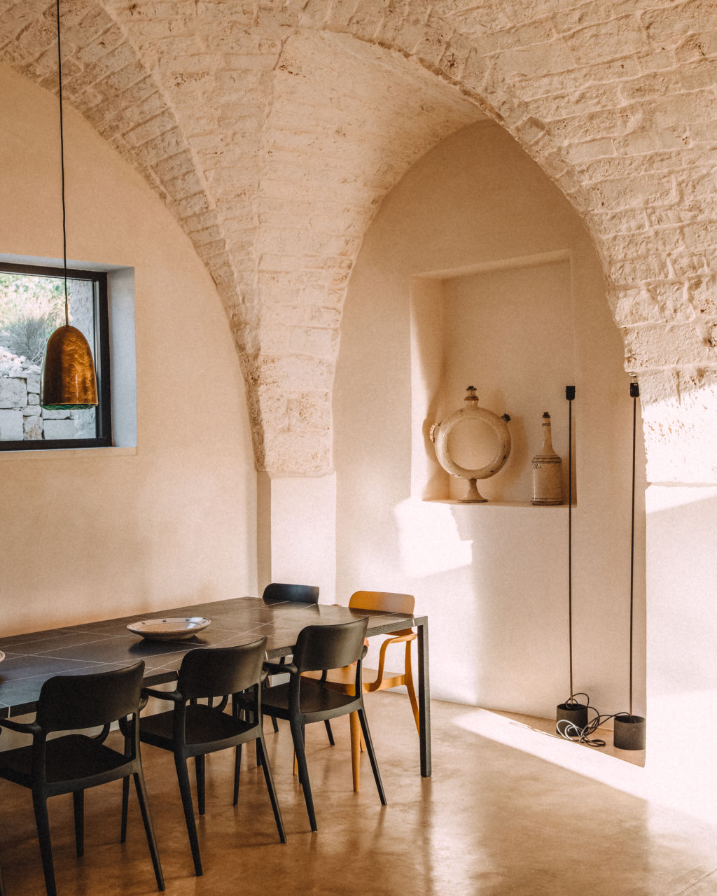 The dining room sits under the arched stone ceiling. Photo: Agi Sibiga