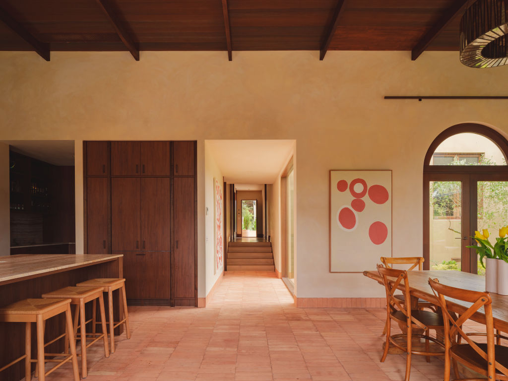Heated Italian terracotta flooring runs through the home. Photo: Victor Vieaux