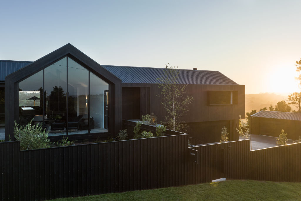 Back in black: This contemporary take on a gabled farmhouse wows at every turn