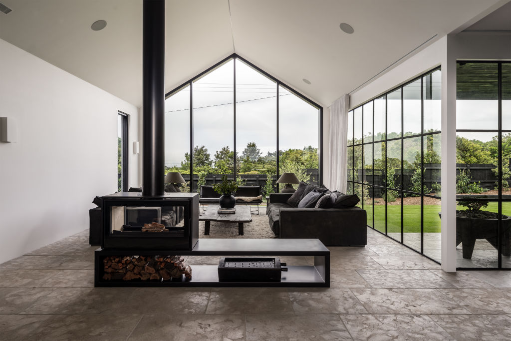 Soaring ceilings and large windows offer sweeping views of the hinterland. Photo: Supplied