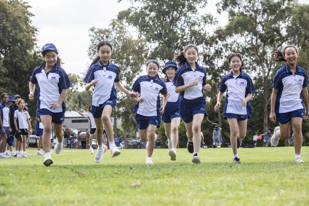 PLC's extensive co-curricular program encourages girls to participate in sport, and music .
