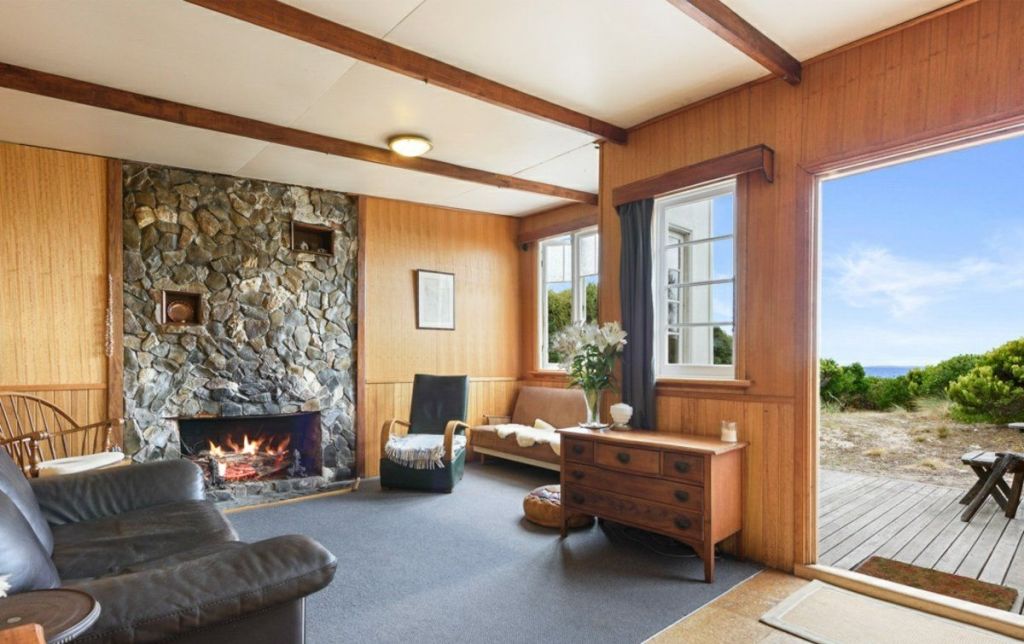 Stone fireplace and timber walls of 16 Gull Street, Rocky Cape TAS 7321 Photo: LJ Hooker