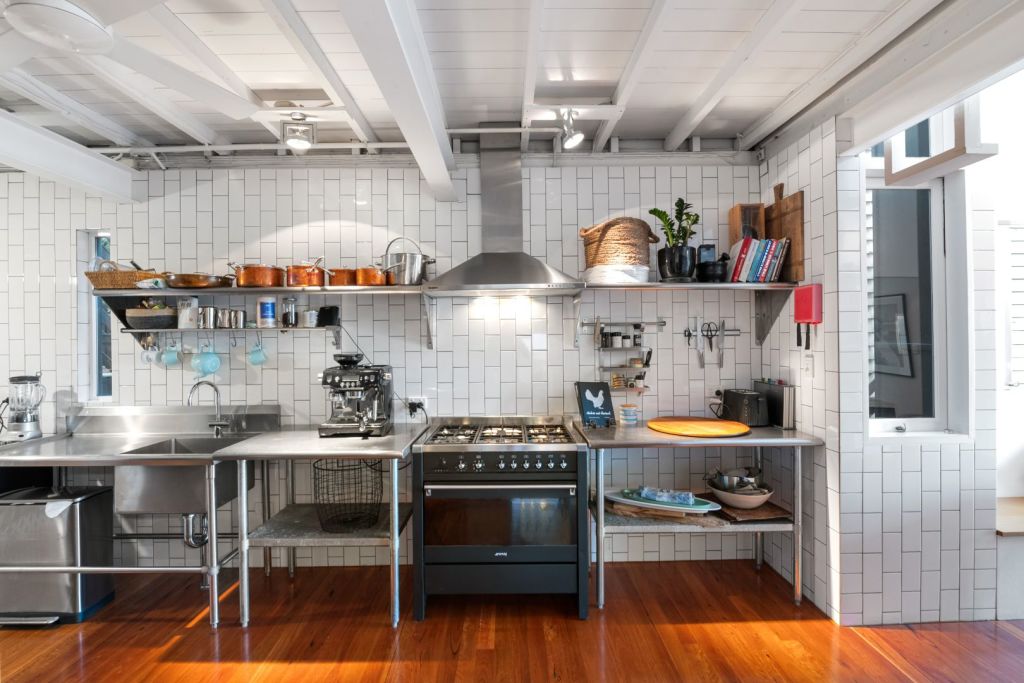 The industrial-style kitchen makes entertaining easy. Photo: Ray White Paddington