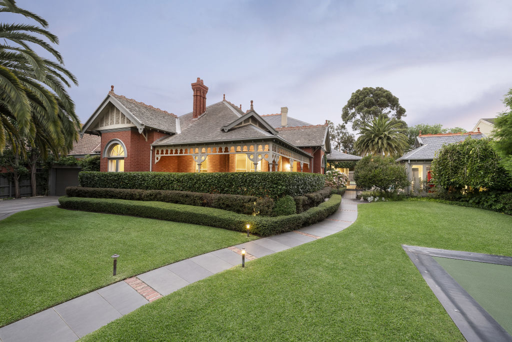 The Queen Anne-style home sits amid impeccably manicured gardens. Photo: Supplied