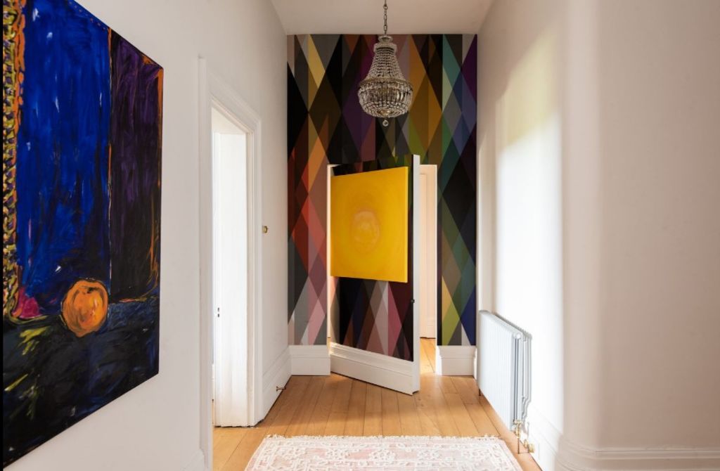 Tasmanian home for sale has a hidden door behind a painting. Photo: Bushby Creese
