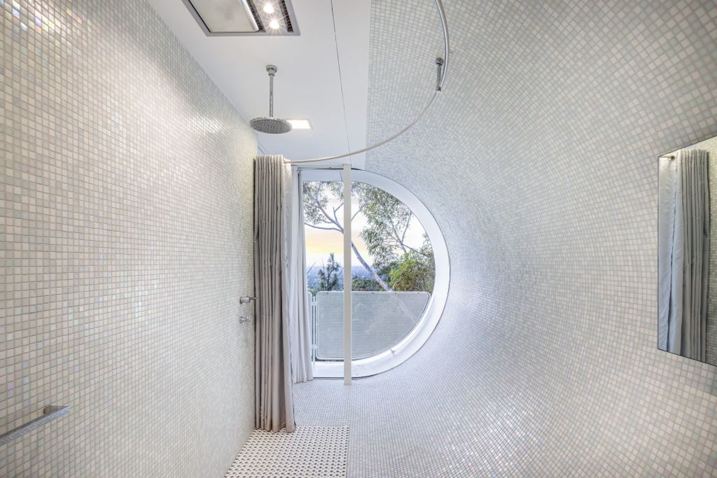 The curvy bathroom is one of many wow moments in the Glen Osmond designer penthouse. Photo: Harris Real Estate