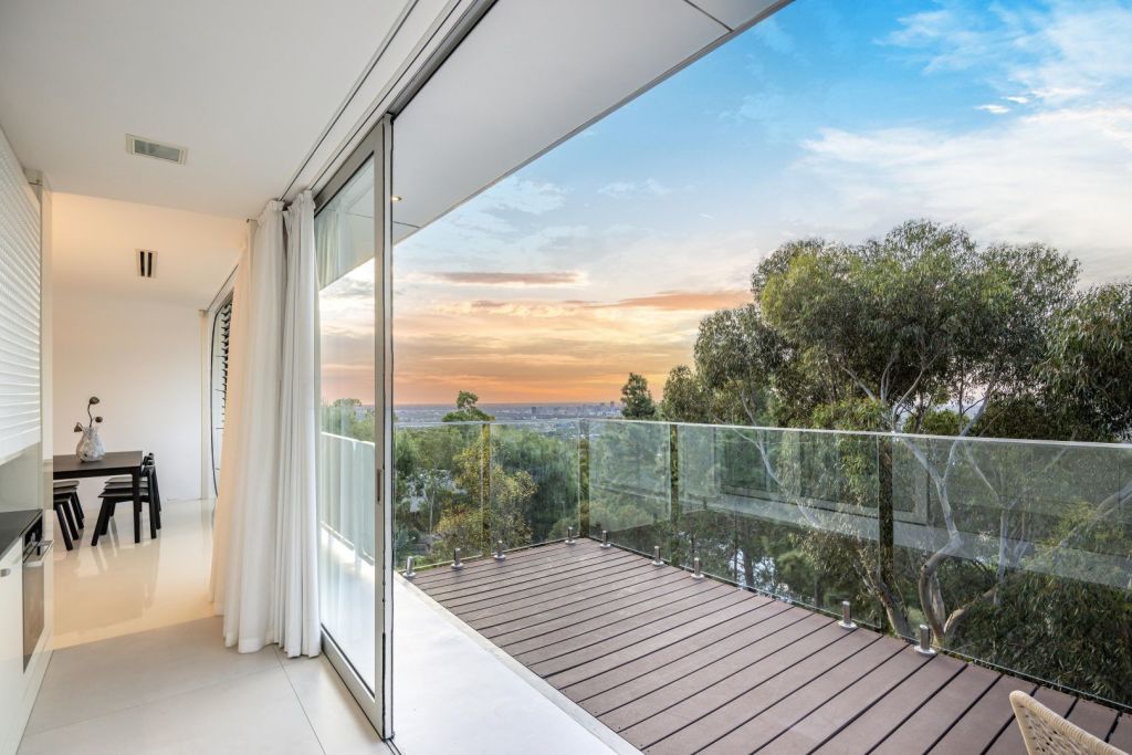 Expressions of interest are sought for the unique estate, suspended above the tree tops, with a central, showpiece garage. Photo: Harris Real Estate