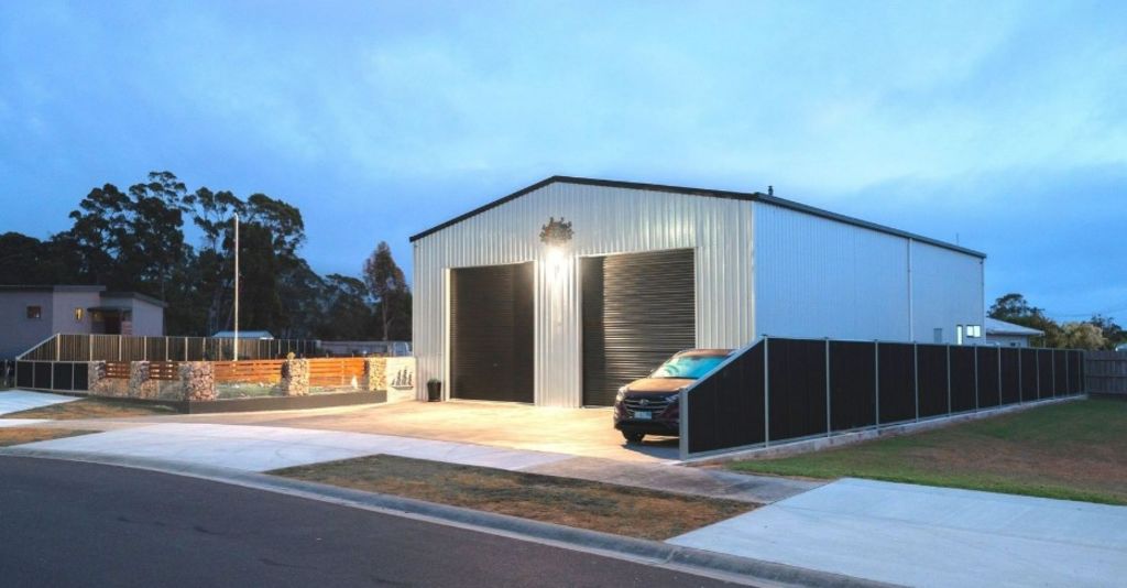 Behind the roller doors of a Tassie shed for sale lies a designer home. Photo: One Agency Burnie