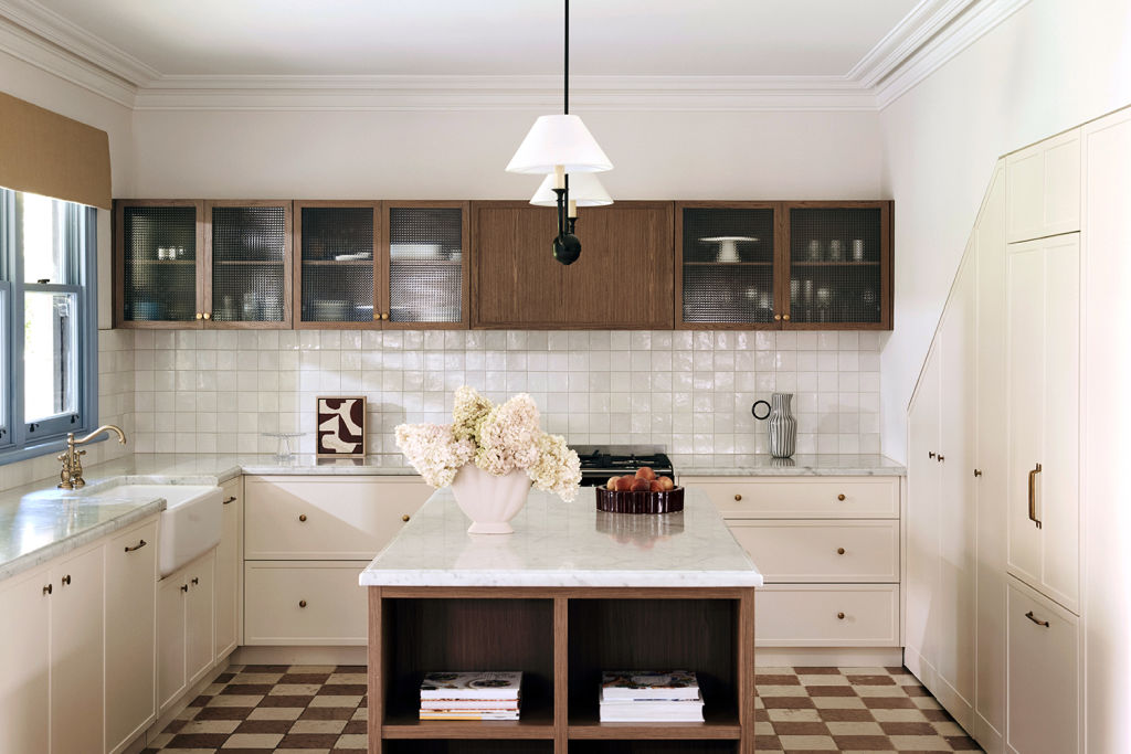The kitchen features a stunning walnut-finished island. Photo: Damian Bennett