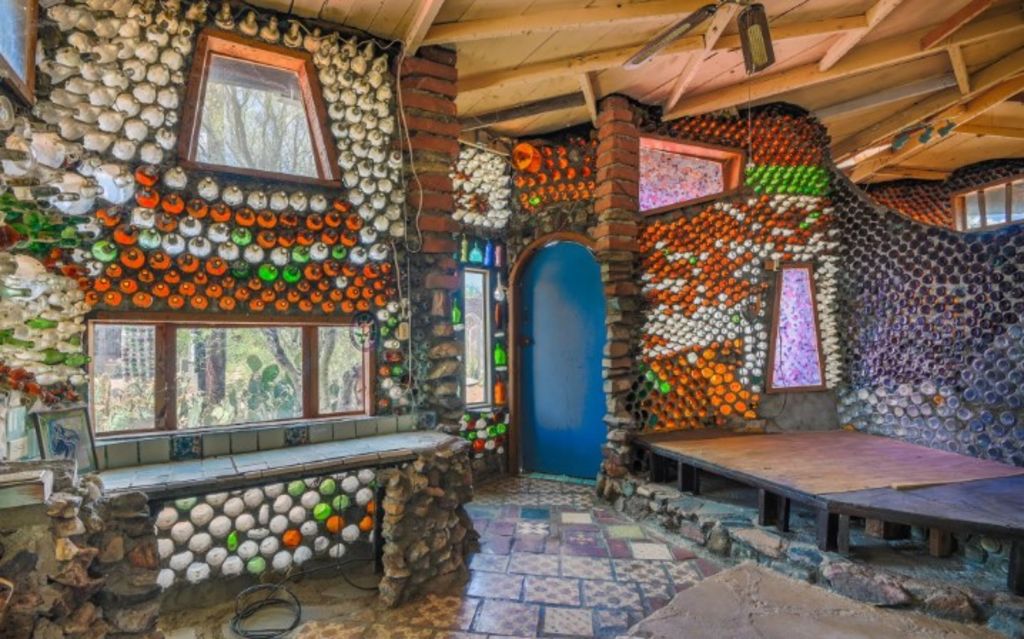The property is referred to as a 'rock and bottle' house on the listing. Photo: Coldwell Banker Commercial Realty
