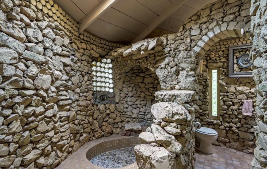 The home features a grotto-style shower and toilet. Photo: Coldwell Banker Commercial Realty