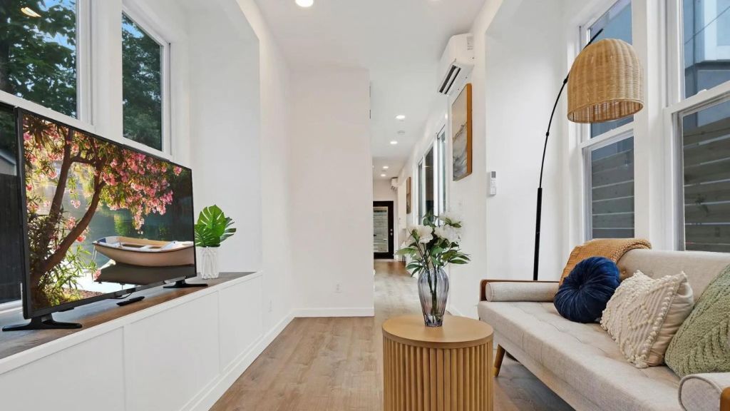 The owners went through 24 architectural iterations before settling on the genius design for the narrow block, between laneways. Photo: Pearson Smith Realty, Llc
