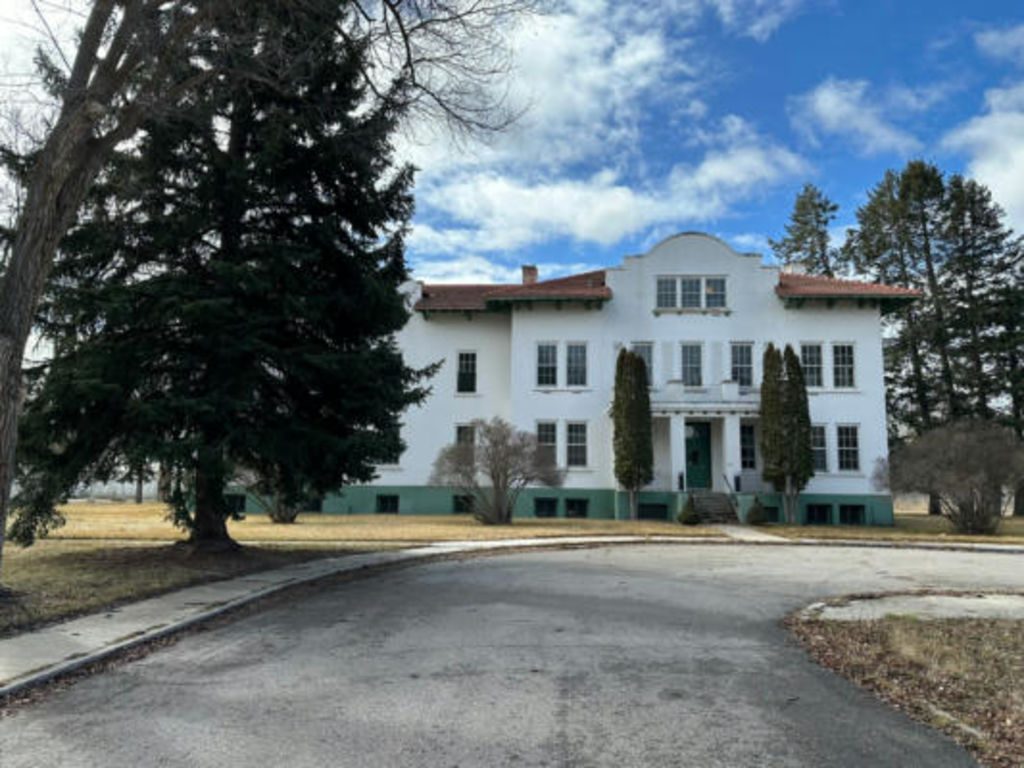 The vendor of the Old Post Hospital in Fort Missoula, Montana, is throwing in $100,000 towards the relocation costs. Photo: Remax