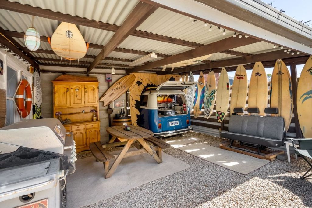 Tassie beach house for sale has a Kombi-themed bar and barbecue area. Photo: McGrath Hobart