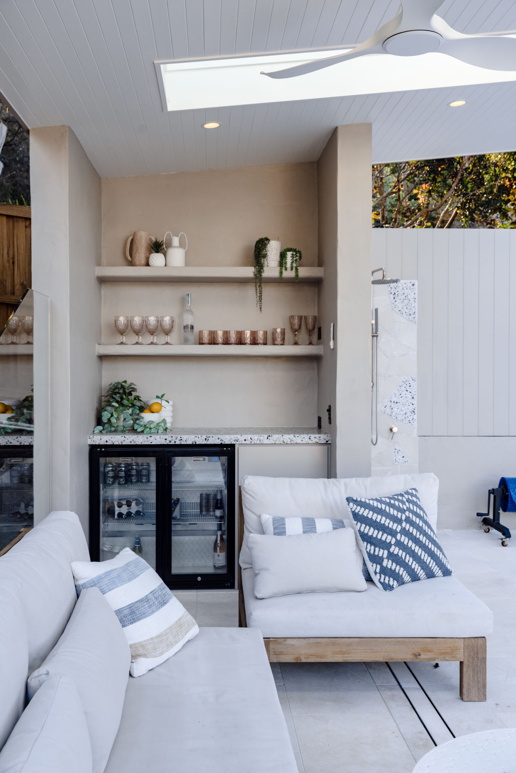 The outdoor space was transformed with limestone pavers, a cabana with a bar, fridge and lounge seating. Photo: Trudy Pagden