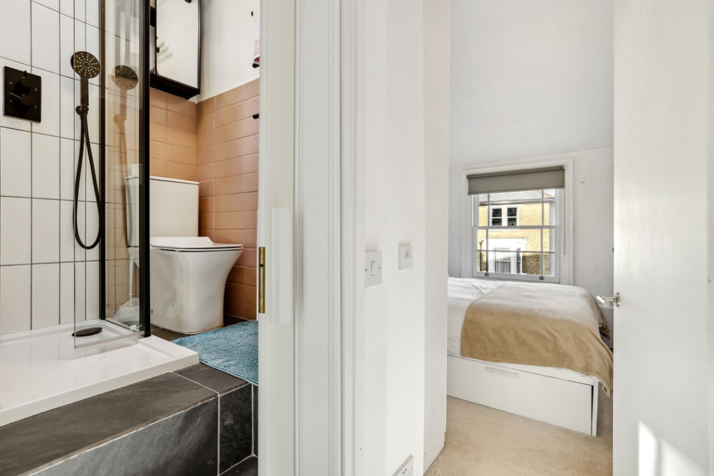 There is still room for two bathrooms and two bedrooms, using the space smartly. Photo: Leslie &amp; Co