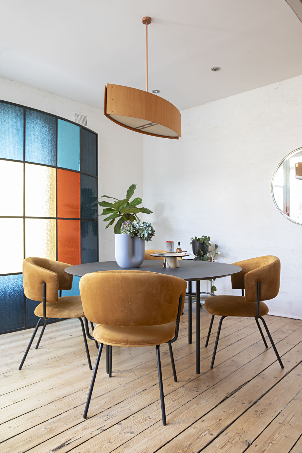 Stained-glass panes are a colourful additon to the dining space. Photo: Natalie Jeffcott