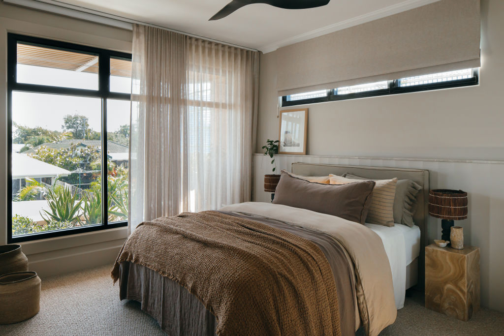 Handmade ceramics, natural brown tones and a relaxed ceiling cornice lend a tranquil, resort vibe to House Two’s third bedroom. Photo: Grace Picot