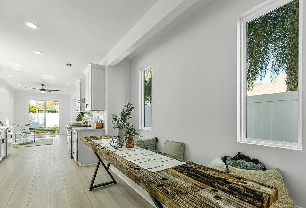 High ceilings and built-in seating feature throughout the space. Photo: Zillow/Oceanside Real Estate