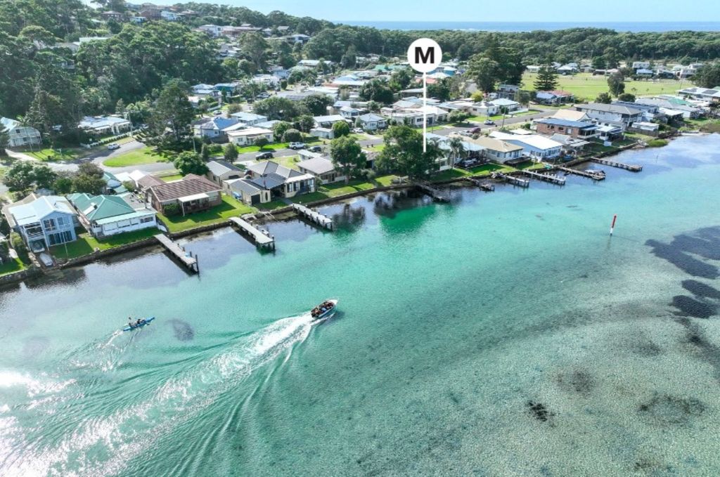 The property in Burrill Lake, New South Wales, is smack bang on the water. Photo: McGrath Estate Agents Ulladulla