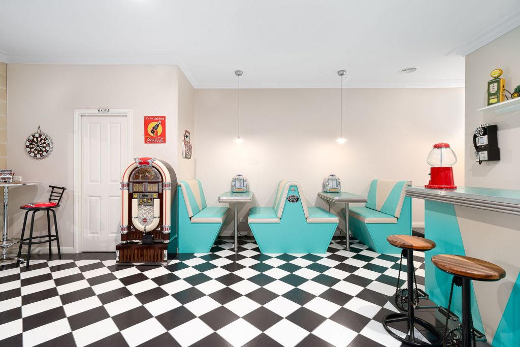 Described on the listing as as "American-themed fun room", the set up has also has a bar and a pinball machine. Photo: Ray White Ballarat