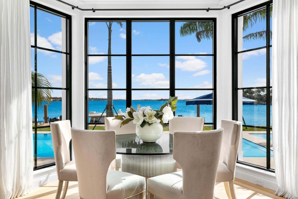 The property has vast water views and includes a day spa wing, plus multiple living zones looking to the water. Photo: The Corcoran Group