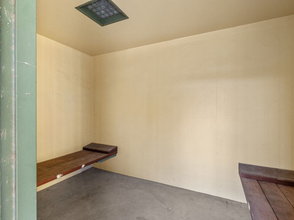 Cramped wooden beds are fitted in the cells. Photo: Elders Real Estate