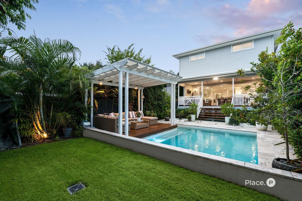 The sparkling swimming pool with waterfall function. Photo: Place Estate Agents New Farm