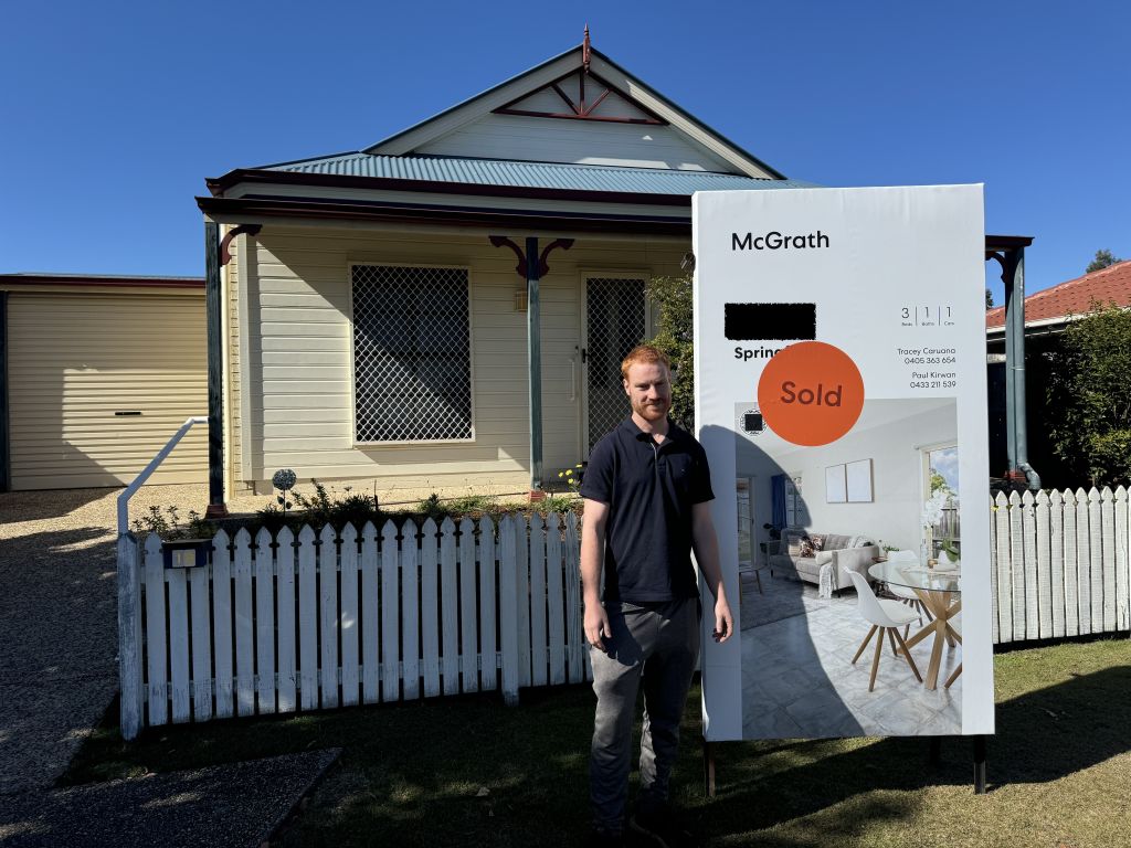 Ben Bailey in front of his new home in Springfield in Greater Brisbane. Photo: Supplied
