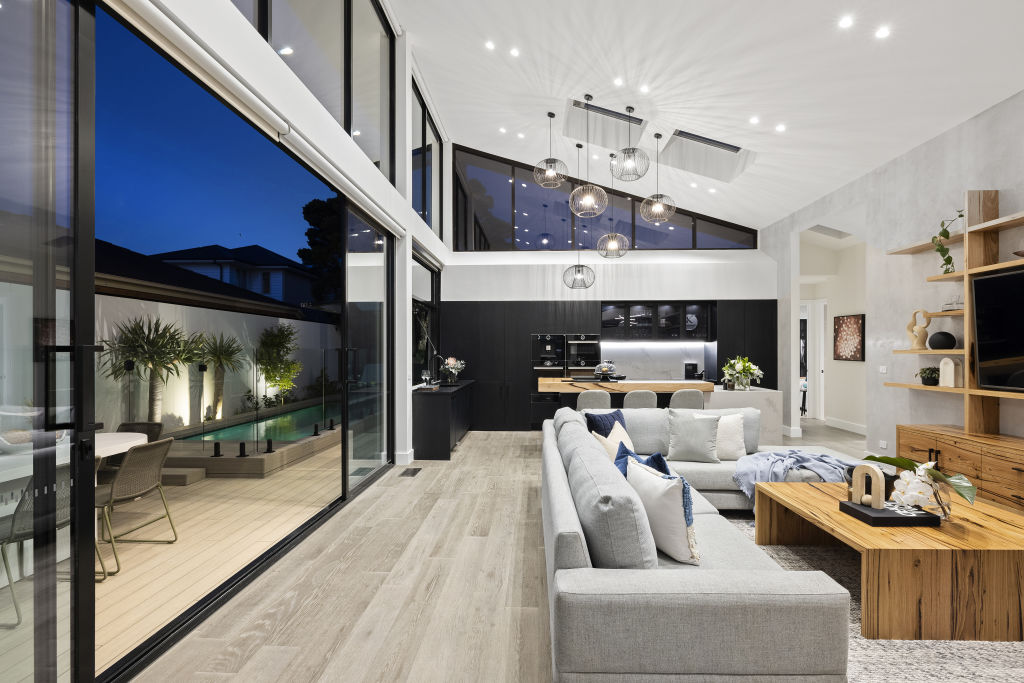 The open-plan living, kitchen and dining area features a vaulted ceiling. Photo: Estate Imagery