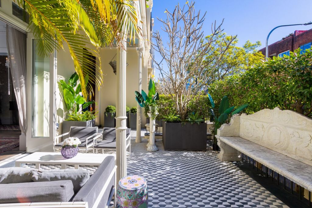 Tessellated tiles grace the romantic front courtyard.