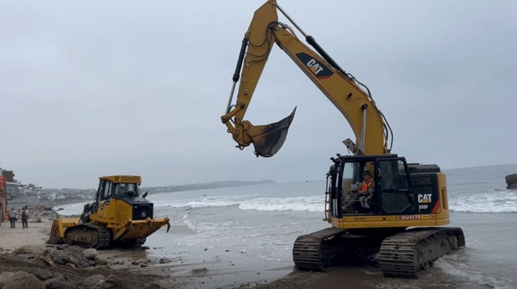 Photograph of excavators on Broad Beach. Photo: Supplied to court