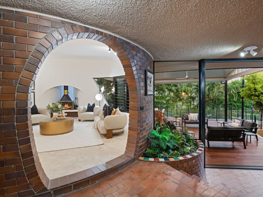 Living room through curved entryway. Photo: Place Graceville