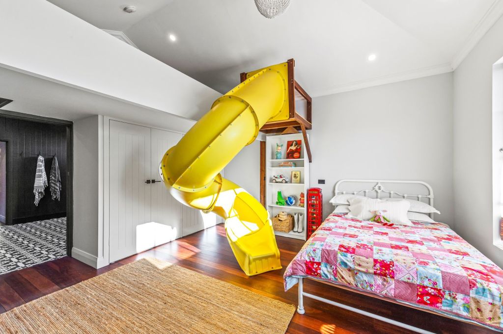 A kids' room comes with an indoor slide. Photo: Ray White Claremont