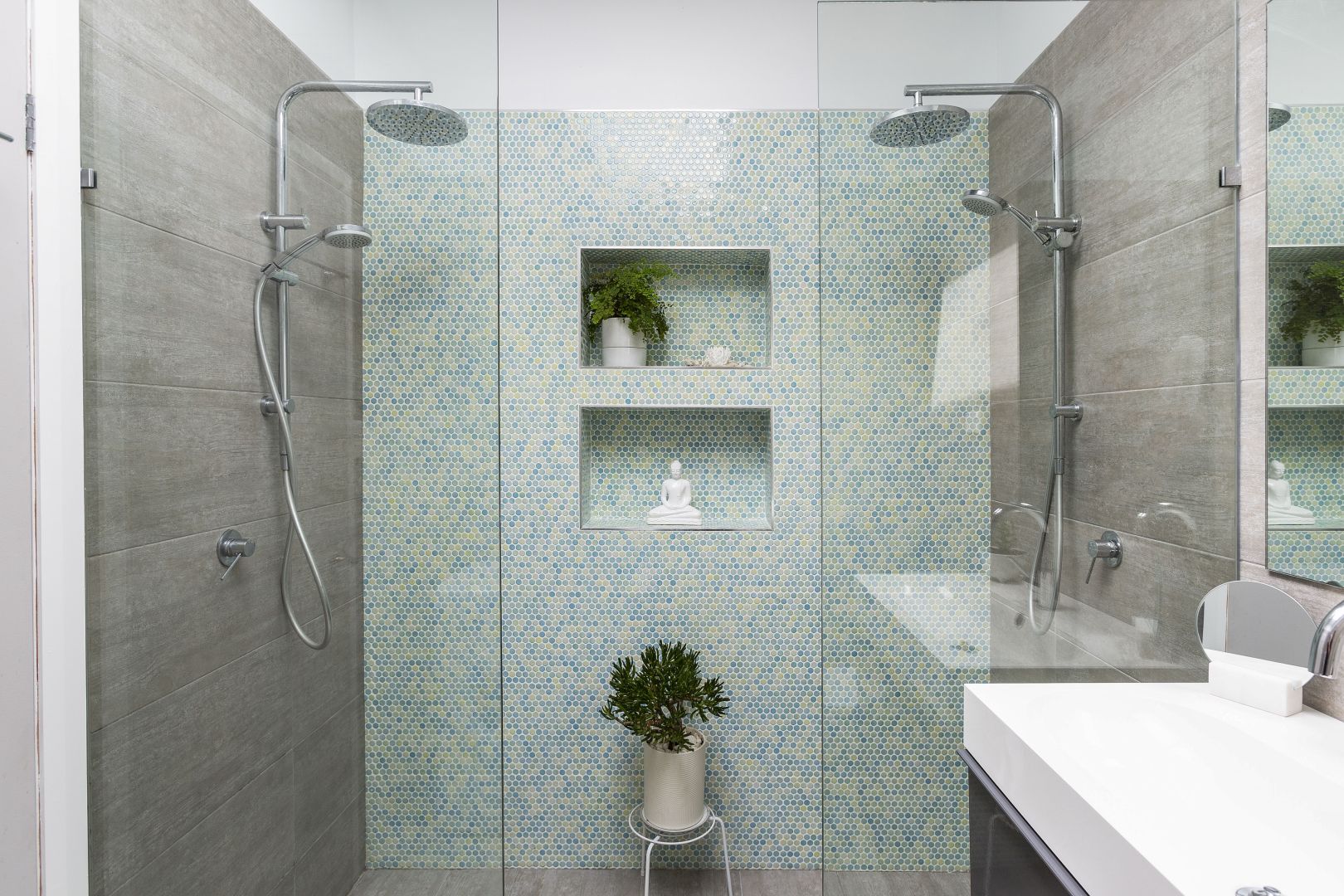 Remove all personal items from bathrooms and add an indoor plant for life and colour.